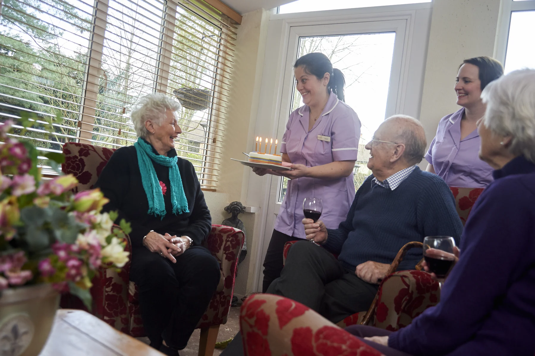 Nettlestead residents and care-team members celebrating a birthday together