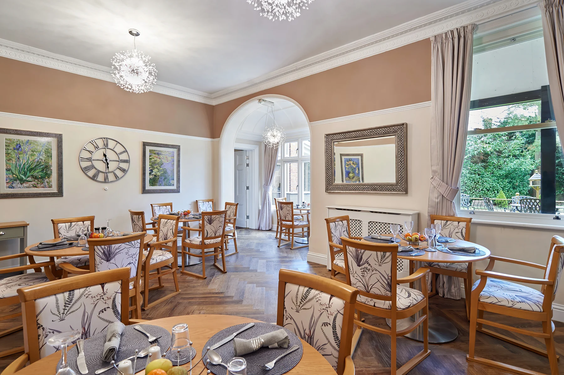 The Nettlestead dining room set for a meal with views into the garden