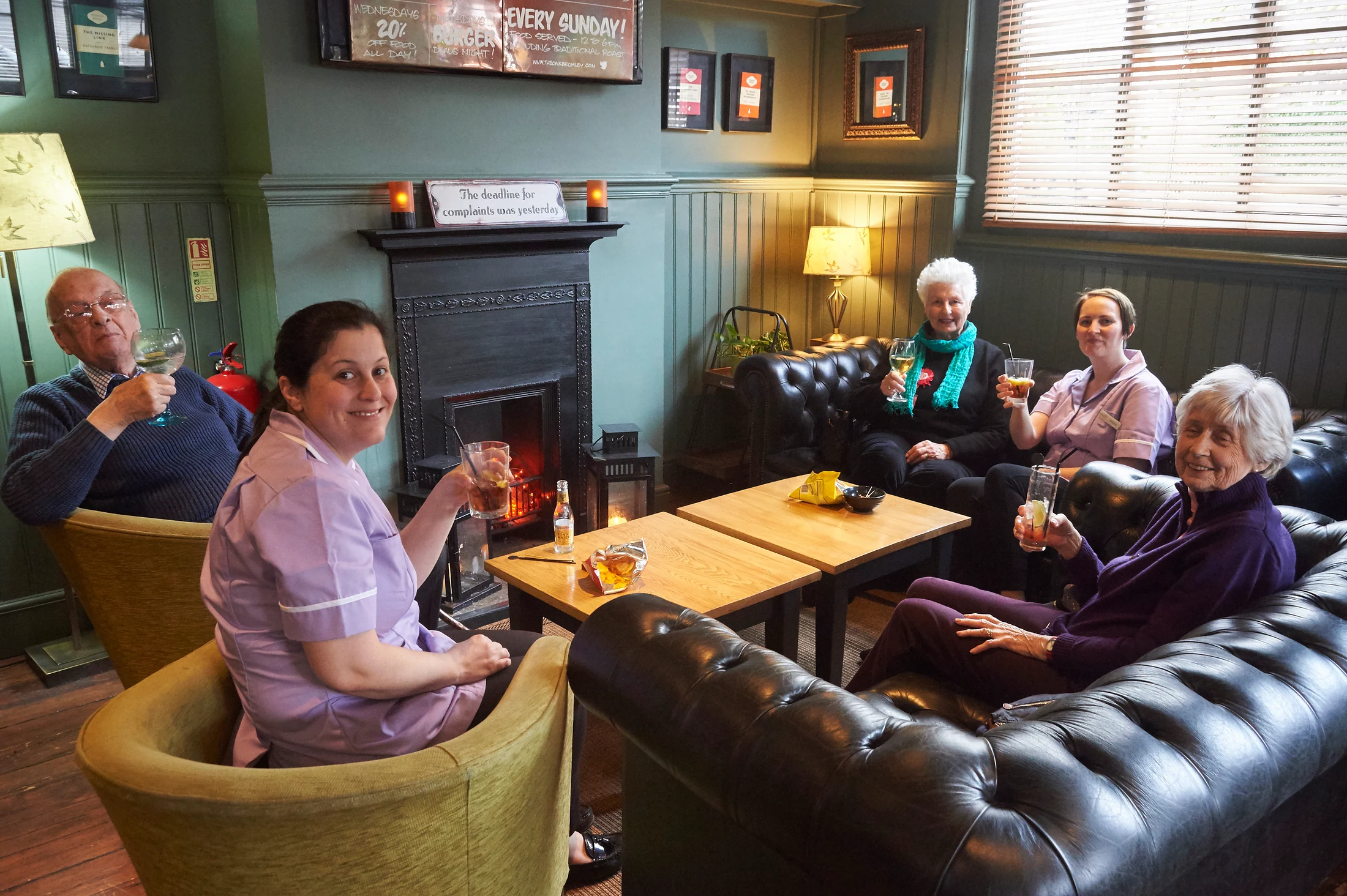 Nettlestead residents and care team members enjoying a relaxed social outing