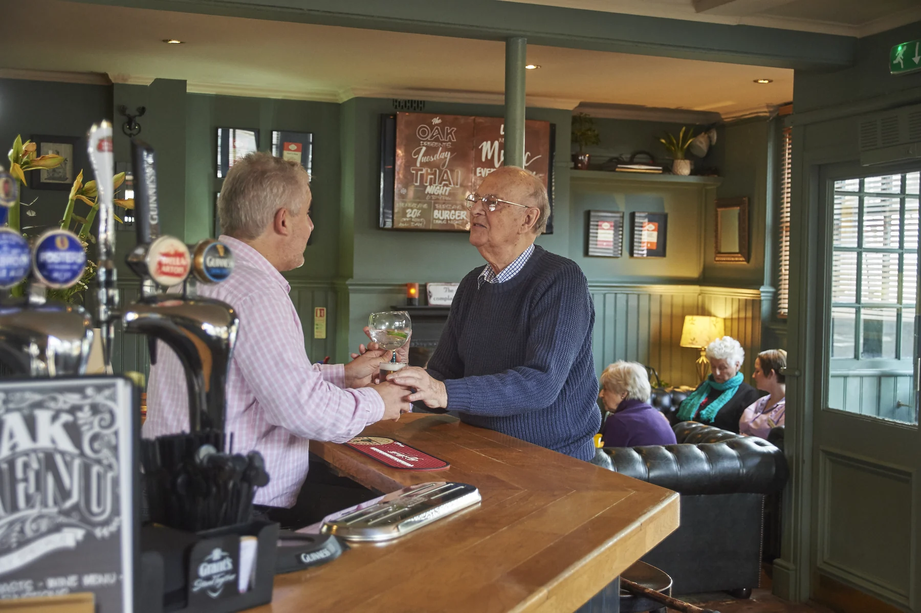 A Nettlestead resident enjoying a drink and conversation during a pub outing