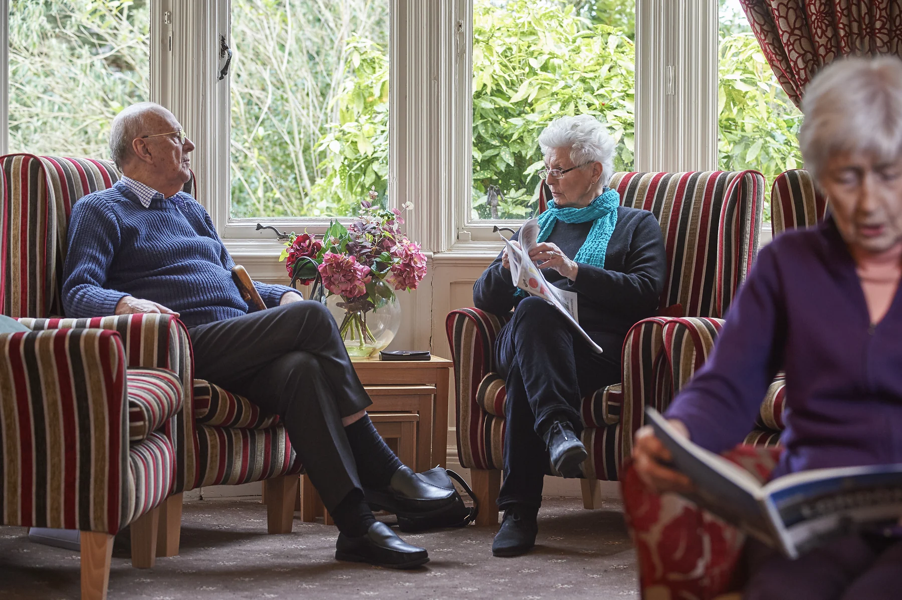 Nettlestead residents relaxing together in a shared lounge
